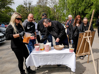 Volunteers of World Central Kitchen give symbolic cup of soup after the funeral of Damian Sobol, a volunteer for World Central Kitchen, who...