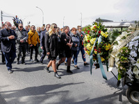 José Andrés, a funder of World Central Kitchen and the family walk in a funeral procession as they attend a funeral of Damian Sobol, a volun...