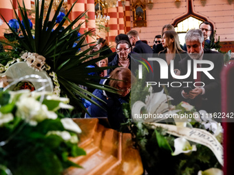 (L-R) Mother, fiancee and Palestinian ambassador to Poland Mahmoud Khalifa attend a funeral of Damian Sobol, a volunteer for World Central K...