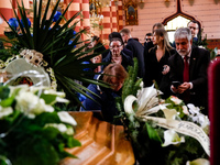 (L-R) Mother, fiancee and Palestinian ambassador to Poland Mahmoud Khalifa attend a funeral of Damian Sobol, a volunteer for World Central K...