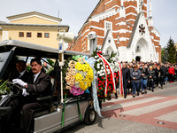 Family and friends walk in a funeral procession as they attend a funeral of Damian Sobol, a volunteer for World Central Kitchen, who was kil...