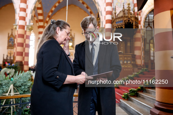 Mother of Damian Sobol, Alicja Houthuijzen-Sobol receives a post-mortum medal from the representative of the President of Polan, Andrzej Dud...