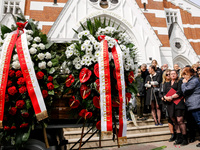 Flowers from President of Poland, Andrzej Duda and Primi Minister of Poland, Donald Tusk are seen as family and friends attend a funeral of...