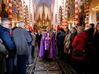 A priest leads a coffin as family and friends attend a funeral of Damian Sobol, a volunteer for World Central Kitchen, who was killed in an...