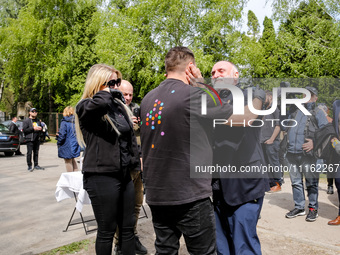 José Andrés, a funder of World Central Kitchen greets with WCK volunteers after the funeral of Damian Sobol, a volunteer for World Central K...