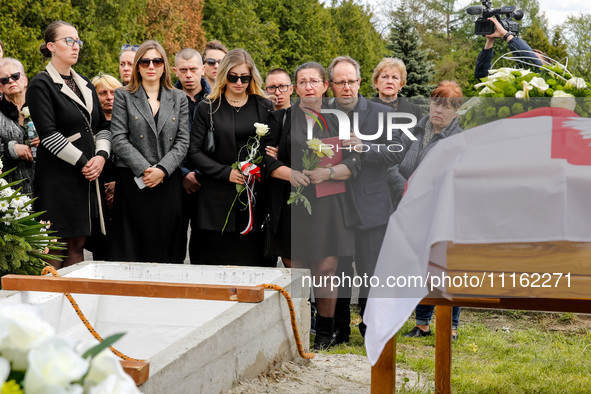 Mother and family show their emotions during a funeral on cemetery of Damian Sobol, a volunteer for World Central Kitchen, who was killed in...