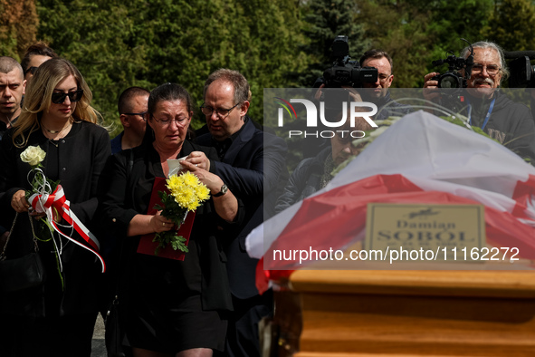 Mother and family show their emotions during a funeral on cemetery of Damian Sobol, a volunteer for World Central Kitchen, who was killed in...