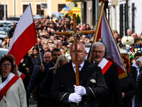 Family and friends walk in a funeral procession as they attend a funeral of Damian Sobol, a volunteer for World Central Kitchen, who was kil...