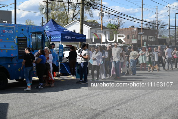 Attendees are lining up at the glazed and confused donut truck on Saturday afternoon at the Cannapalooza for 420, a celebration for weed con...