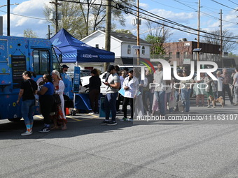 Attendees are lining up at the glazed and confused donut truck on Saturday afternoon at the Cannapalooza for 420, a celebration for weed con...