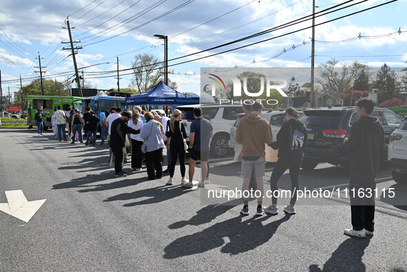 Attendees are lining up at the glazed and confused donut truck on Saturday afternoon at the Cannapalooza for 420, a celebration for weed con...