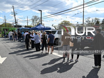 Attendees are lining up at the glazed and confused donut truck on Saturday afternoon at the Cannapalooza for 420, a celebration for weed con...