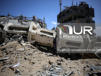 A Palestinian man is walking past a destroyed mosque in Nuseirat, Gaza Strip, on April 21, 2024, amid ongoing battles between Israel and the...