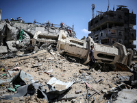 A Palestinian man is walking past a destroyed mosque in Nuseirat, Gaza Strip, on April 21, 2024, amid ongoing battles between Israel and the...