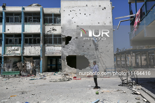 An UNRWA-run school is lying in ruins during the ongoing conflict between Israel and the Palestinian Islamist group Hamas, in Nuseirat, cent...