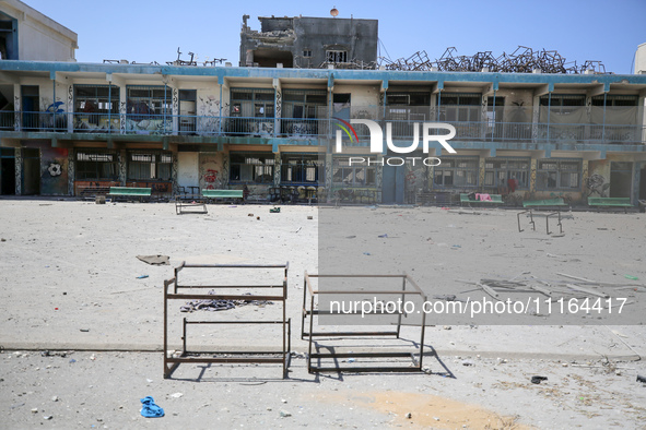 An UNRWA-run school is lying in ruins following its destruction during Israel's military offensive, amid the ongoing conflict between Israel...