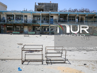 An UNRWA-run school is lying in ruins following its destruction during Israel's military offensive, amid the ongoing conflict between Israel...