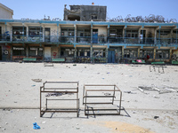 An UNRWA-run school is lying in ruins following its destruction during Israel's military offensive, amid the ongoing conflict between Israel...