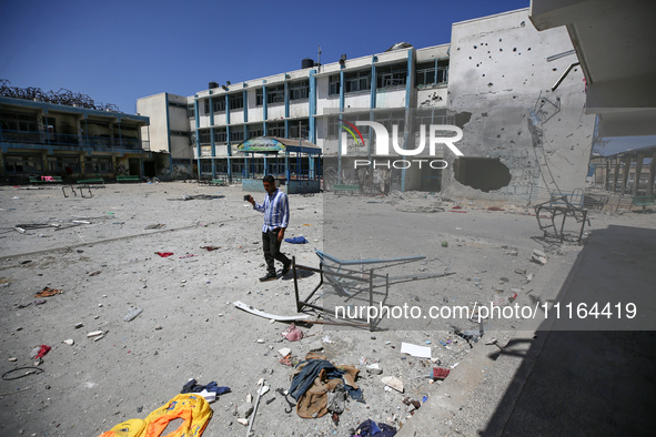 An UNRWA-run school is lying in ruins during the ongoing conflict between Israel and the Palestinian Islamist group Hamas, in Nuseirat, cent...