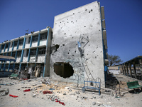 An UNRWA-run school is lying in ruins following its destruction during Israel's military offensive, amid the ongoing conflict between Israel...