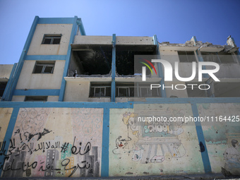 An UNRWA-run school is lying in ruins during the ongoing conflict between Israel and the Palestinian Islamist group Hamas, in Nuseirat, cent...