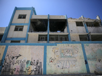 An UNRWA-run school is lying in ruins during the ongoing conflict between Israel and the Palestinian Islamist group Hamas, in Nuseirat, cent...