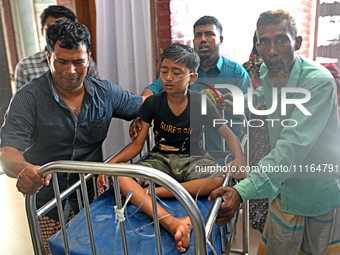 A child is receiving medical treatment for pneumonia at Dhaka Child Hospital amid an ongoing heatwave in Dhaka, Bangladesh, on April 21, 202...