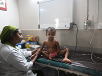 A child is receiving medical treatment for pneumonia at Dhaka Child Hospital amid an ongoing heatwave in Dhaka, Bangladesh, on April 21, 202...