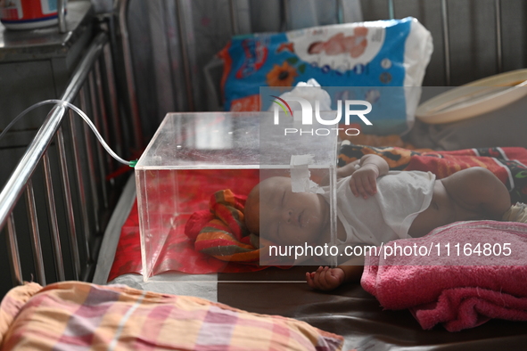 A child is receiving medical treatment for pneumonia at Dhaka Child Hospital amid an ongoing heatwave in Dhaka, Bangladesh, on April 21, 202...