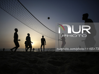 Palestinians are enjoying the beach on a hot day amid the ongoing conflict between Israel and Hamas in Deir Al-Balah, in the central Gaza St...