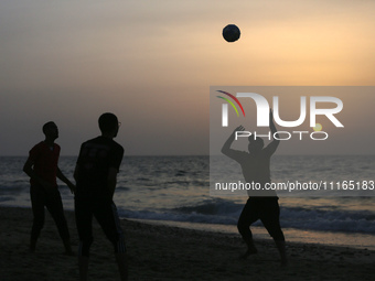 Palestinians are enjoying the beach on a hot day amid the ongoing conflict between Israel and Hamas in Deir Al-Balah, in the central Gaza St...