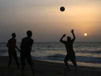 Palestinians are enjoying the beach on a hot day amid the ongoing conflict between Israel and Hamas in Deir Al-Balah, in the central Gaza St...