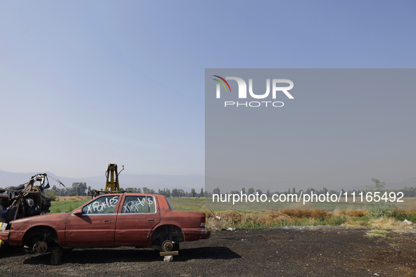 An abandoned car is seen in the Chalco-Xico Lake area, State of Mexico, on World Earth Day. The United Nations declared April 22 as World Mo...