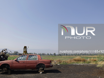 An abandoned car is seen in the Chalco-Xico Lake area, State of Mexico, on World Earth Day. The United Nations declared April 22 as World Mo...