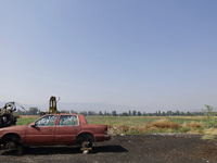 An abandoned car is seen in the Chalco-Xico Lake area, State of Mexico, on World Earth Day. The United Nations declared April 22 as World Mo...