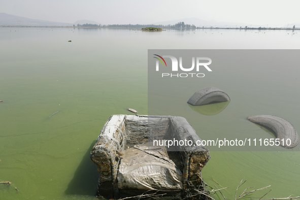 An armchair is sitting in Lake Chalco-Xico, State of Mexico. This Sunday is World Earth Day, which the United Nations declared as World Moth...