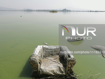 An armchair is sitting in Lake Chalco-Xico, State of Mexico. This Sunday is World Earth Day, which the United Nations declared as World Moth...