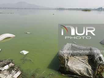 An armchair is sitting in Lake Chalco-Xico, State of Mexico. This Sunday is World Earth Day, which the United Nations declared as World Moth...