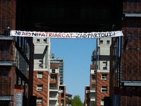 A banner is suspended dozens of meters above the ground, reading 'Neither A69 nor patriarchy, ZAD everywhere'. ZAD stands for Zone To Defend...