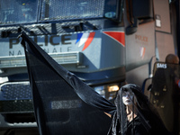 A Black Rebel from XR is standing in front of a police water cannon. Several thousand people are demonstrating in the streets of Toulouse, F...