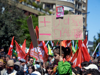 A young girl is holding a placard that reads 'More birds, less highways' as several thousand people are demonstrating in the streets of Toul...