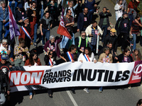 Members of La France Insoumise (France Unbowed) are holding a banner that reads 'Stop to big useless projects'. Several thousand people are...