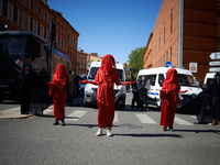 Red Rebels from Extinction Rebellion are standing in front of riot police in Toulouse, France, on April 21, 2024. Several thousand people ar...