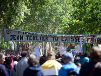 Protesters are marching in the streets of Toulouse, France, on April 21, 2024, displaying a banner that reads 'Pierre Fabre shareholder, Jea...