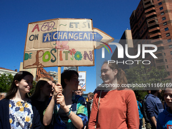 Three women are holding a placard that reads 'A69 and if we change the position'. Several thousand people are demonstrating in the streets o...