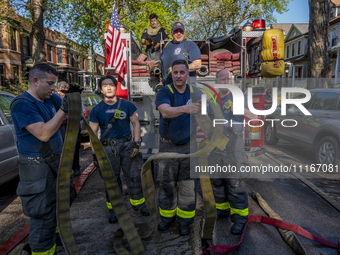 The Chicago Fire Department and Chicago Police Department respond to a structure fire at 1921 West Newport Avenue, in Chicago, IL, in the Ro...