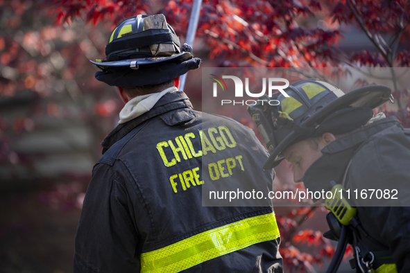 The Chicago Fire Department and Chicago Police Department respond to a structure fire at 1921 West Newport Avenue, in Chicago, IL, in the Ro...