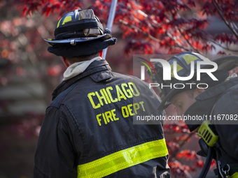 The Chicago Fire Department and Chicago Police Department respond to a structure fire at 1921 West Newport Avenue, in Chicago, IL, in the Ro...