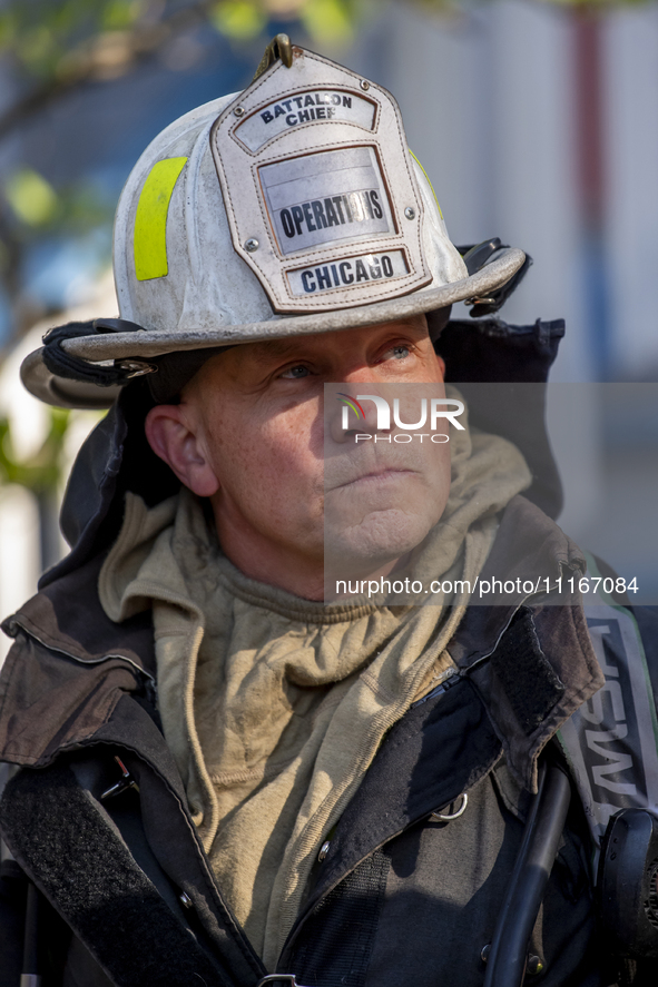 The Chicago Fire Department and Chicago Police Department respond to a structure fire at 1921 West Newport Avenue, in Chicago, IL, in the Ro...