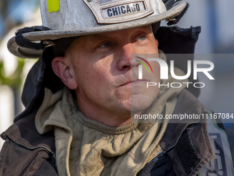 The Chicago Fire Department and Chicago Police Department respond to a structure fire at 1921 West Newport Avenue, in Chicago, IL, in the Ro...